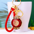 Round Jeweled Fortune Plaque Keychains in Blue, Red and Yellow view 1