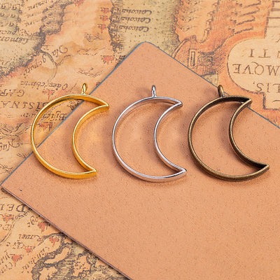 Open Crescent Moon Alloy Pendant Charm displayed in a grouped product arrangement