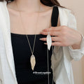 Textured Long Leaf Pendant Necklace Two Metal Tones view 1