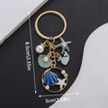 Blue and Pink Shell Dolphin Mermaid and Starfish Keychains view 6