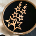 Gold Tone Open Star Long Cascade Statement Dangle Earrings view 1