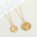 Gold Tone Filigree Bird and Moon Star Round Pendant Necklaces view 1