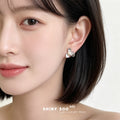 Silver Tone Ridged Three Petal Flower And White Pearl Stud Earrings view 2