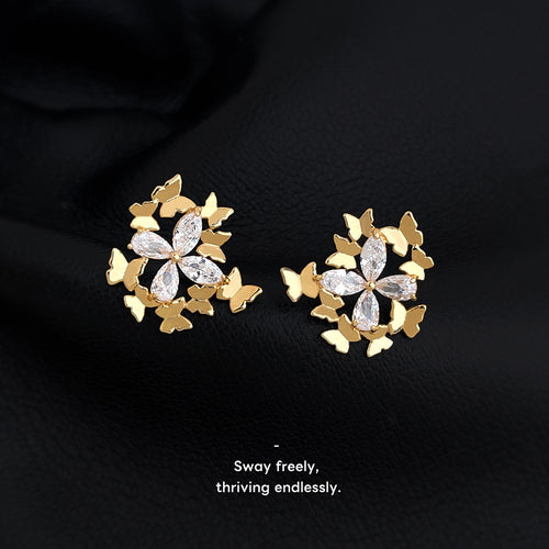 Gold-tone butterfly-cluster clear-stone-flower studs in the first product display.