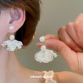 White Floral Stud and Pearl Drop Earrings in Two Styles view 4
