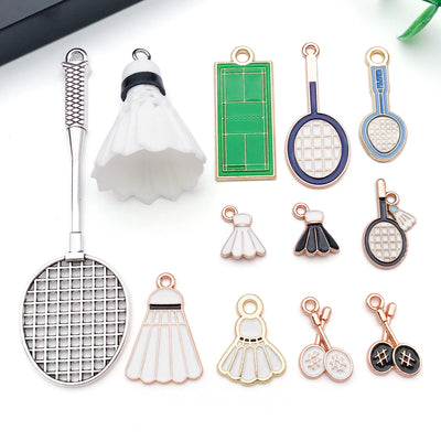 Metallic assorted shape charms arranged on a light background