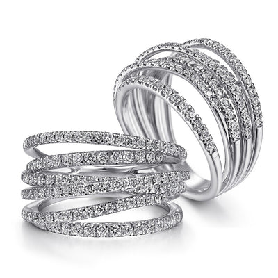 Two silver multi-band wrap pave clear stone rings on white background