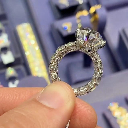 Side profile of marquise ring showing fully paved white gold band