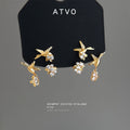 Gold Tone Bird Leaf Branch And Clear Flower Stud Earrings view 1