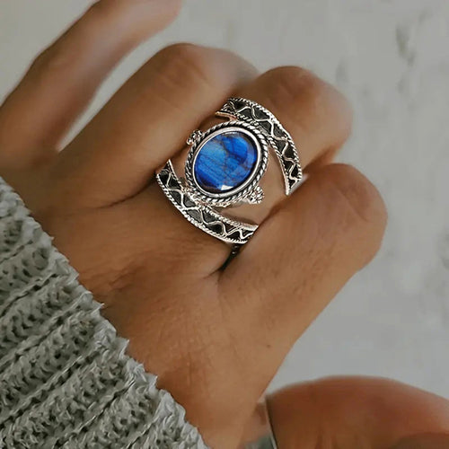 Antique silver blue cabochon ring worn clenched hand
