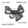 Black Bow Pearl Brooch With Faceted Crystals And Polished Metal Details view 4