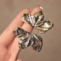 Two Tone Crinkled Leaf Stud Earrings in Gold and Silver view 2
