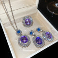 Purple Oval Crystal Halo Necklace Earrings Ring Set view 1