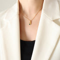 Gold Hand Holding Green Zircon Pendant Ball Chain Necklace view 6