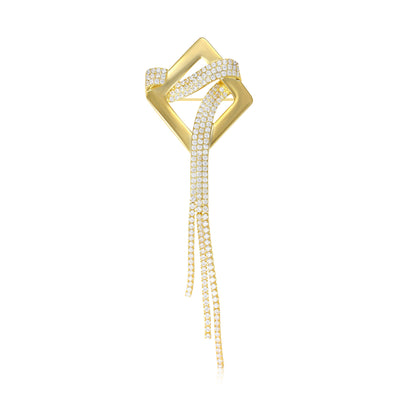Front view of the gold geometric brooch with long chain tassels with polished metal detail on a white background