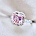 Pink Square Solitaire Halo Ring In Polished Silver Tone view 1