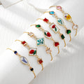 Gold Tone Pressed Flower Crystal Heart Slider Bracelets in Nine Designs view 1