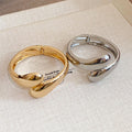 Twisted Teardrop Open Hinge Bangle Gold and Silver view 2