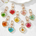 Gold Tone Pressed Flower Daisy Heart Snap-Hook Keychains in Ten Options view 1