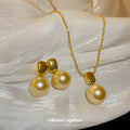 Gold Tone Champagne Pearl Like Pendant Necklace And Drop Earring Set view 1