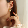 Wrinkled Irregular Textured Metal Stud Earrings Gold Steel Pair view 1