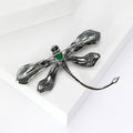 Green Dragonfly Metal Brooch with Dark Green Wings, a Pink Center Stone, and Curved Tail view 3
