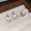 Gold Pearl Rocking Horse Drop Earrings Open Horse Ring view 1