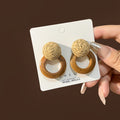 Three Woven and Wood Look Round Statement Earrings view 2