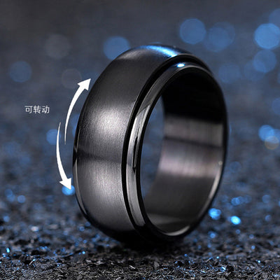 Black spinner ring with Chinese rotatable arrows on blue glitter
