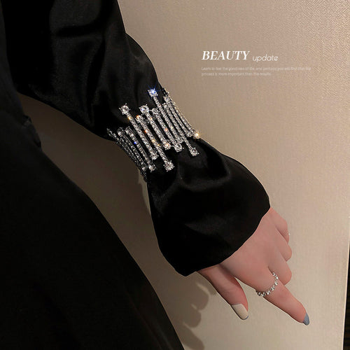 wide silver-tone bracelet made from vertical crystal bars shown in the first close product view