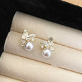 Gold Tone Butterfly Stud Earrings with White Pearl Drops view 6