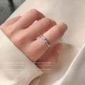 Crossed Open Rings In Polished Silver And Gold Tone view 3