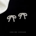 Silver Tone Clear Stone Ribbon Bow Stud Earrings With Pave Finish view 4