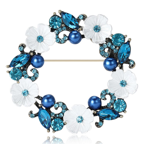Blue floral wreath brooch with white flowers and blue pearls