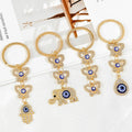 Gold Rhinestone Evil Eye Keychain With Butterfly And Hamsa Charm view 1
