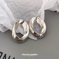 Silver Tone Sculpted Oval Statement Stud Earrings With Polished Metal Details view 4