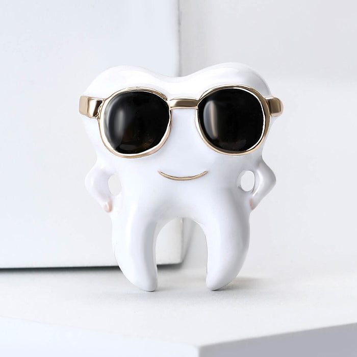 Tooth With Sunglasses Brooch In Metal With White Enamel, Black Lenses, And Gold-Tone