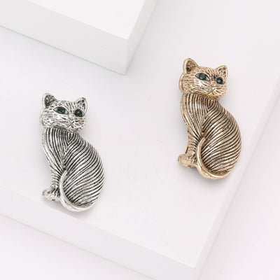 Product display showing a striped sitting cat with bright crystal eyes