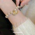 Gold Tone Irregular Pearl Like Slider Bracelet With Shell Charm view 2
