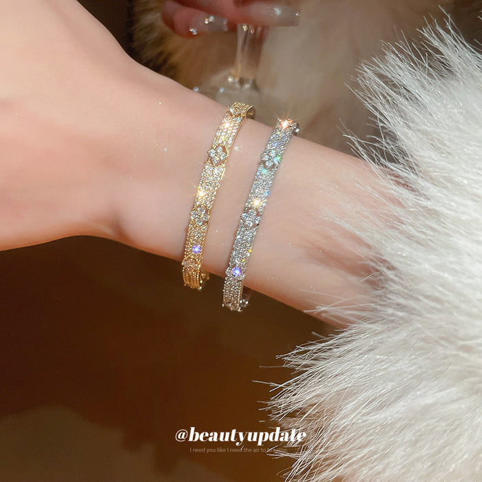 Raised Flower Crystal Hinged Bangle In Gold Tone Or Silver Tone