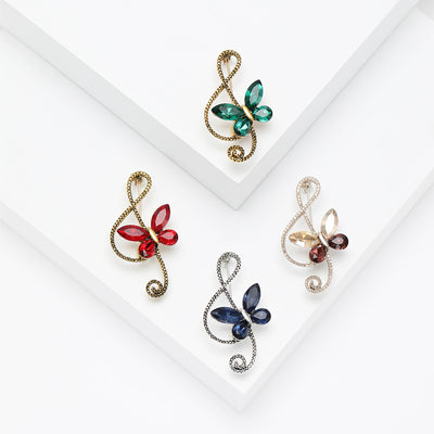 Butterfly Treble Clef Brooch shown on a clean white display