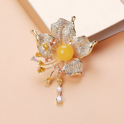 Flower Tassel brooch shown in the available finishes