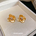 Gold Tone Flower Stud Earrings With Clear Crystal Centers view 3
