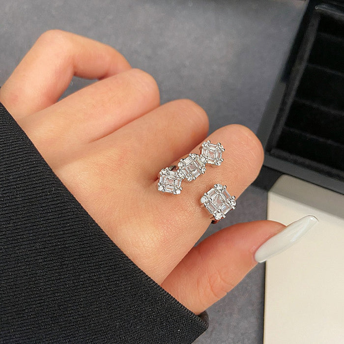 Silver Open Ring With Four Linked Square Clear Stones