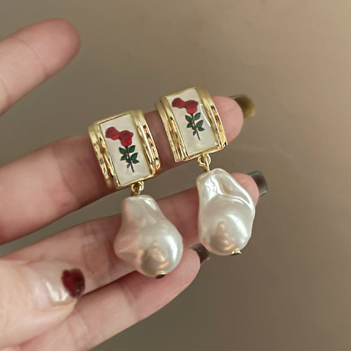 Enamel Floral Tile and Baroque Pearl Drop Earrings shown in arranged product view