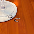 Silver Twist Huggie Hoop Earrings with Black Heart Accent view 4