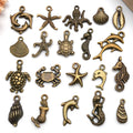 Gold-Tone Starfish and Shell Shell Charms with 26 Listed Options view 1