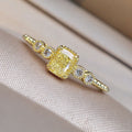 Yellow Cushion Center Three-Stone Slim Ring In Polished Gold Tone view 1