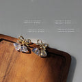 Gold Tone Bow And Iridescent Faceted Twin Drop Stud Earrings view 3