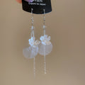 White Floral Disc and Chain Hook Earrings with Polished Metal Details view 6